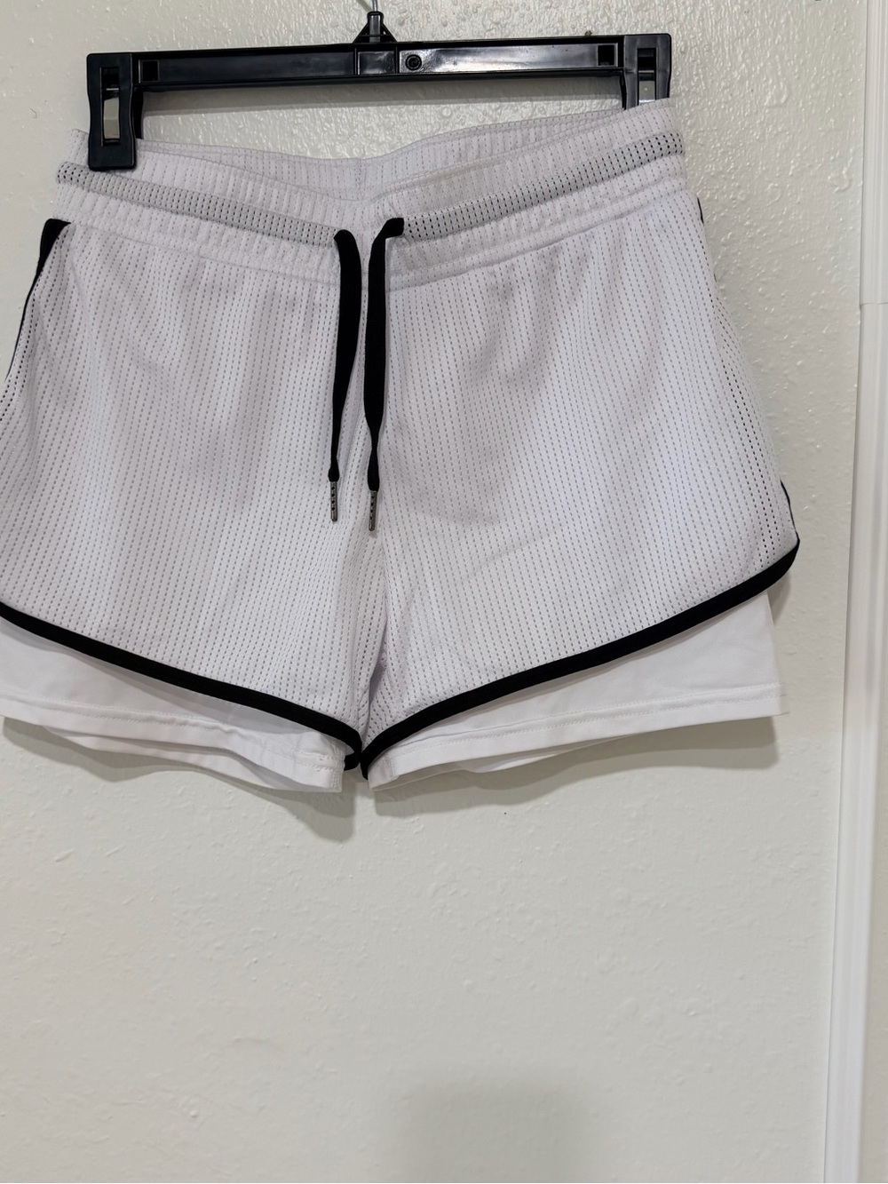 White Athletic Mesh Shorts with Black Trim and Drawstring